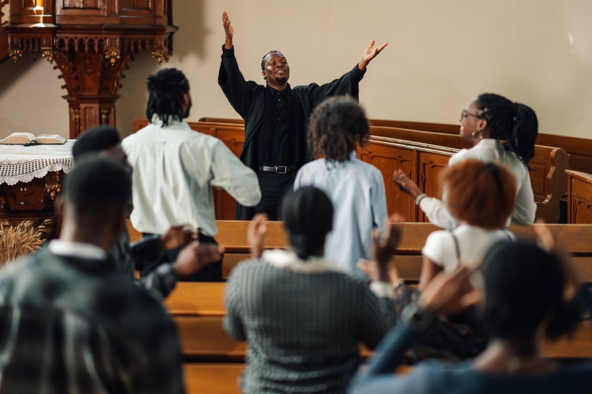 Diverse congregation worshiping in a bright modern church